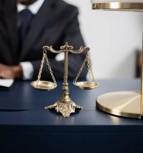 Brass Colored Balance Scale on a Lawyer's Table
